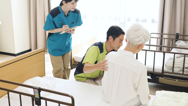 Asian caregiver instructing how to change positions