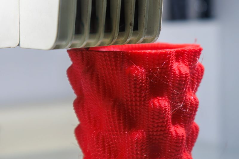 Close up scene the 3D printer operation by additive manufacturing process. The high technology manufacturing process by rapid prototype method.