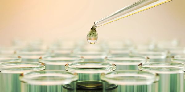Droplet falling from a pipette.