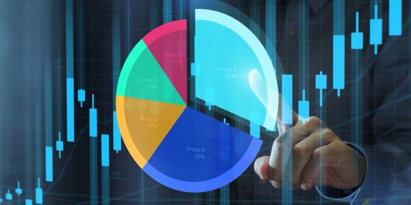 Person interacting with a virtual pie chart and financial trading bars.