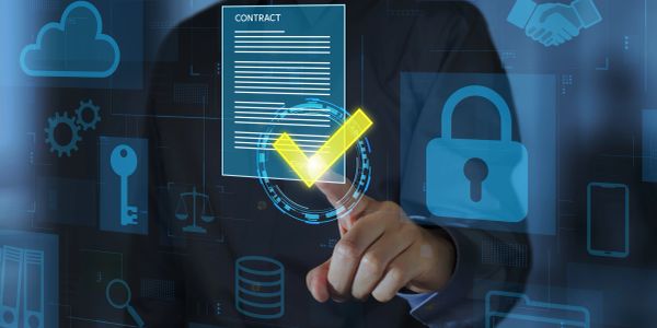 Person interacting with digital contract and security icons on screen.