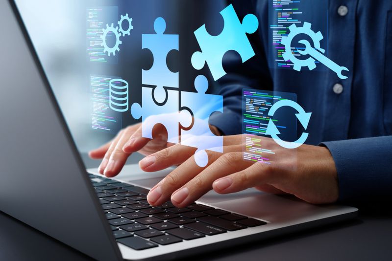 Business person using a laptop to build applications.