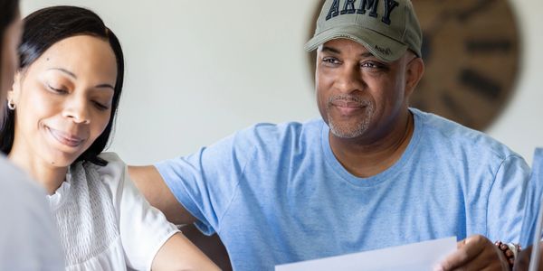 Attorney Williams discussing a successful TDIU rating increase with a military veteran