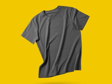 Floating dark gray t-shirt on a yellow background.