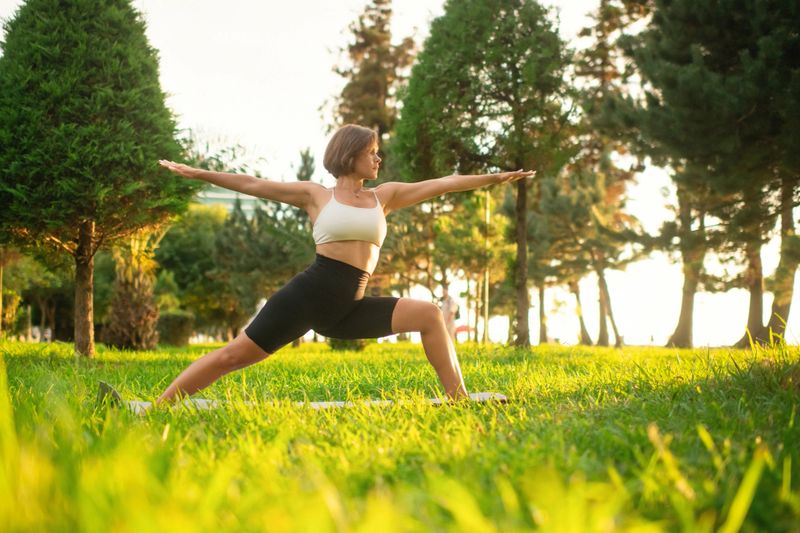 Young woman practicing  yoga outdoors