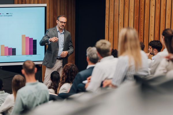 Businessman giving a presentation to an audience.