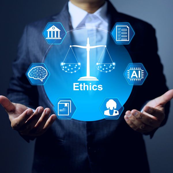 Businessman holding a digital ethics concept with icons.