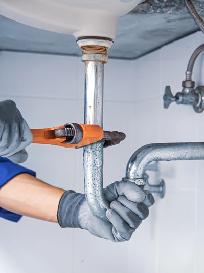Plumbers conducting standard water heater repair in Carmel, IN.