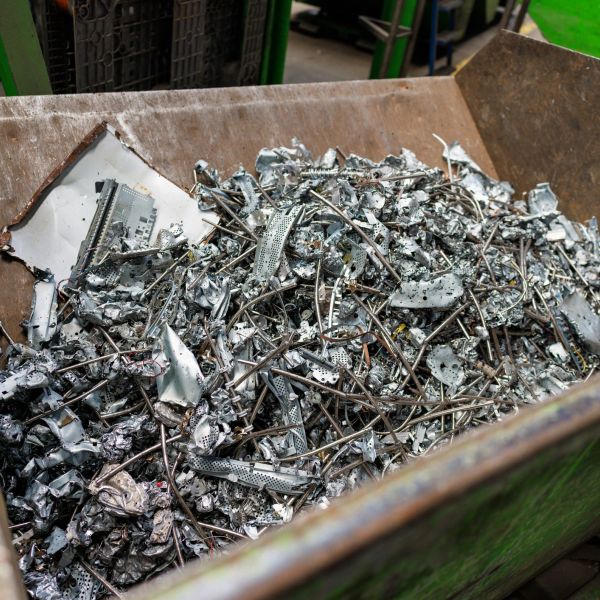 Metal scraps and wires in a container.