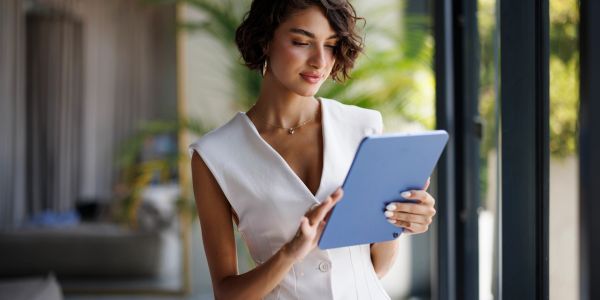Woman using tablet indoors.