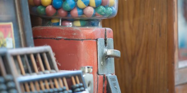 Close-up of a vintage gumball machine.