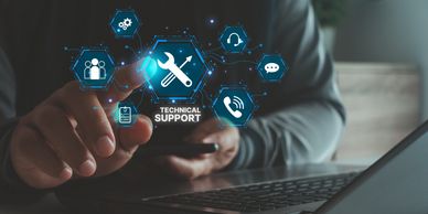 Person accessing digital technical support icons on a laptop.