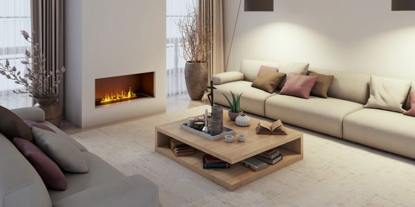 Modern living room with a cozy fireplace and neutral-toned furniture.