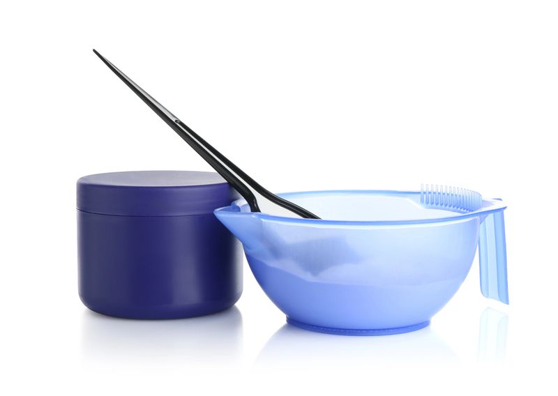 Care cosmetic product for blonde hair, powder and brush isolated on white