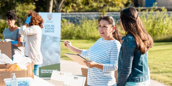 Volunteer delivering food donations.