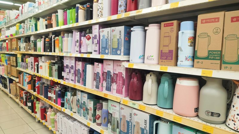 Malaysia Kuala Terengganu October 7, 2025: hot water kettles displayed on shelves for sale in a supermarket. Electrical jug and kettles are placed. price check, product lifespan, sustainability.