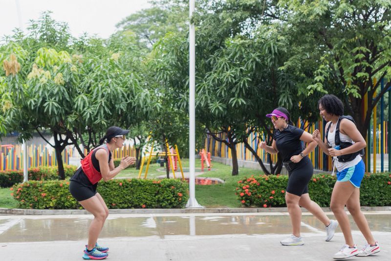 Group of women training outdoors, working towards fitness goals
