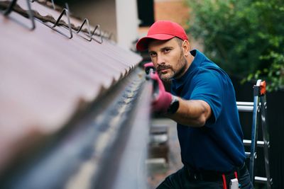Gutter repair being performed on a residential home in Toronto