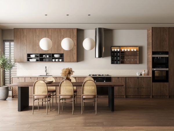 Modern kitchen with wooden cabinets and stylish dining chairs.