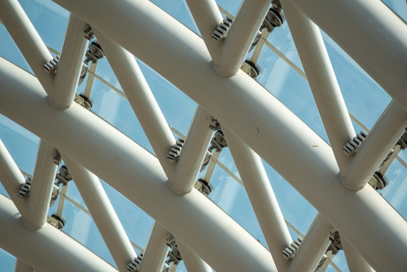 Close-up of a modern architectural structure with intersecting beams.