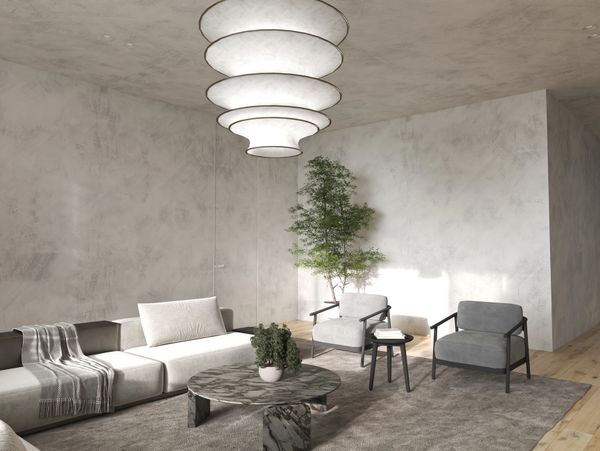 Minimalist living room with modern furniture and a statement ceiling light.