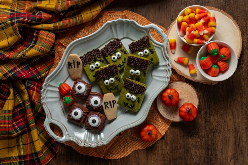 Matcha green tea cream sandwich cookies for halloween on rustic wooden table