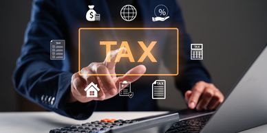 Businessman interacts with a digital tax concept interface.