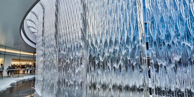 Indoor cascading water wall inside a modern building.