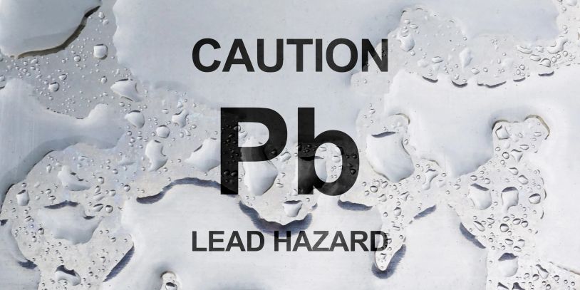 Warning sign for lead hazard with Pb symbol.