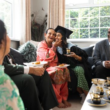 Graduation celebration with family sharing joyful moments.