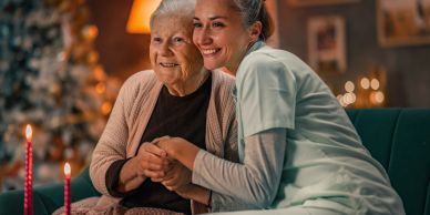Three elderly friends joyfully sharing a meal in a cozy kitchen.