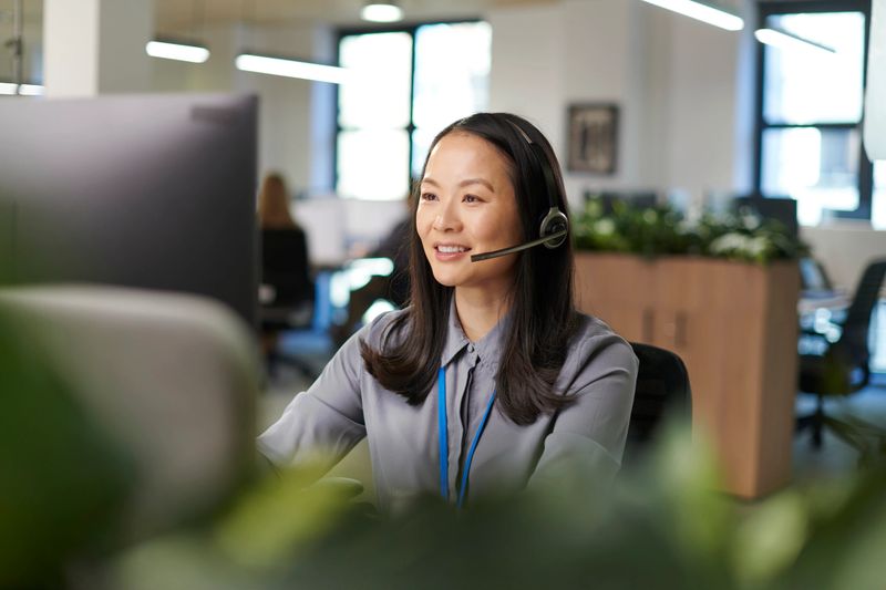 Happy call handler helping a customer