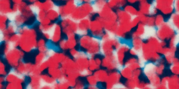Abstract pattern with red, white, and blue colors blending in a tie-dye style.