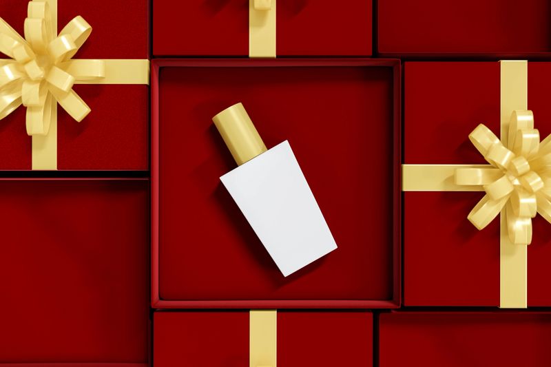 Luxury liquid bottle beauty spray perfume in red velvet gift box present with golden ribbon on lid. Advertising Mockup, 3D Rendering, 3D Illustration.