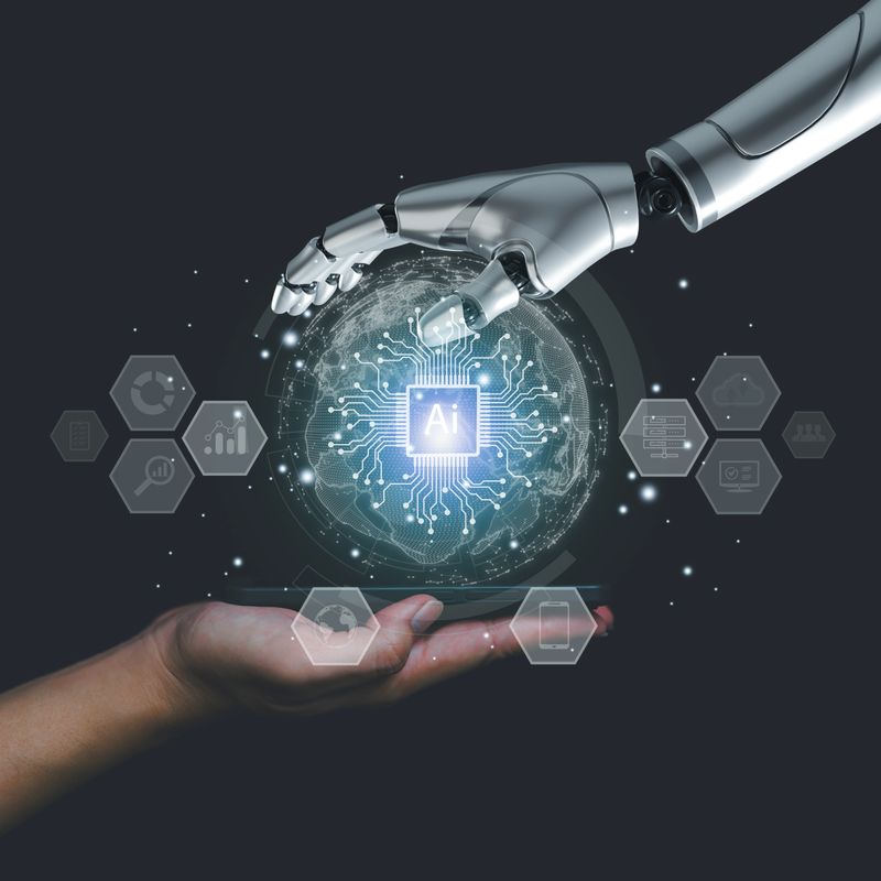 Human and robotic hands holding digital globe with AI chip, symbolizing artificial intelligence collaboration, technology innovation, machine learning and futuristic connection concepts.