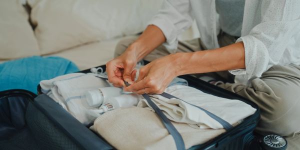 Elderly woman showing elbow pain to a healthcare professional.