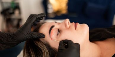 Skin treatment near the eye with gloves.