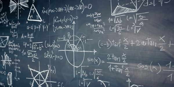 Complex math equations on a blackboard.
