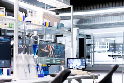 Modern laboratory with computer screens and scientific equipment.