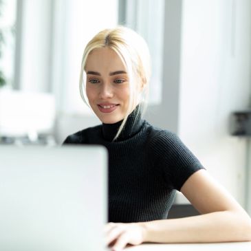 Young woman working on a laptop.