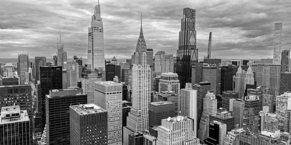 New York City skyline with cloudy sky.