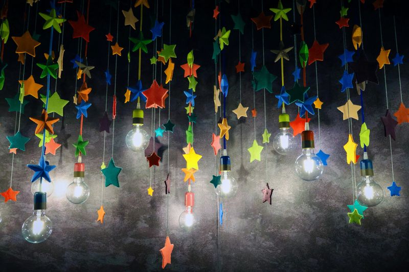 colorful stars hung between retro lamps