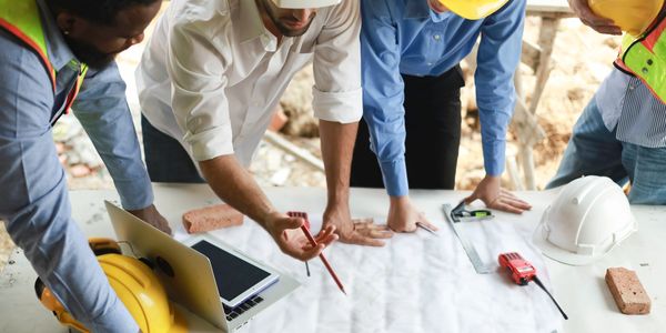 Team of engineers planning a construction project.