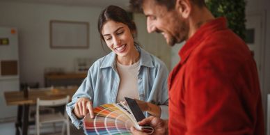 Couple choosing paint colors from a palette.