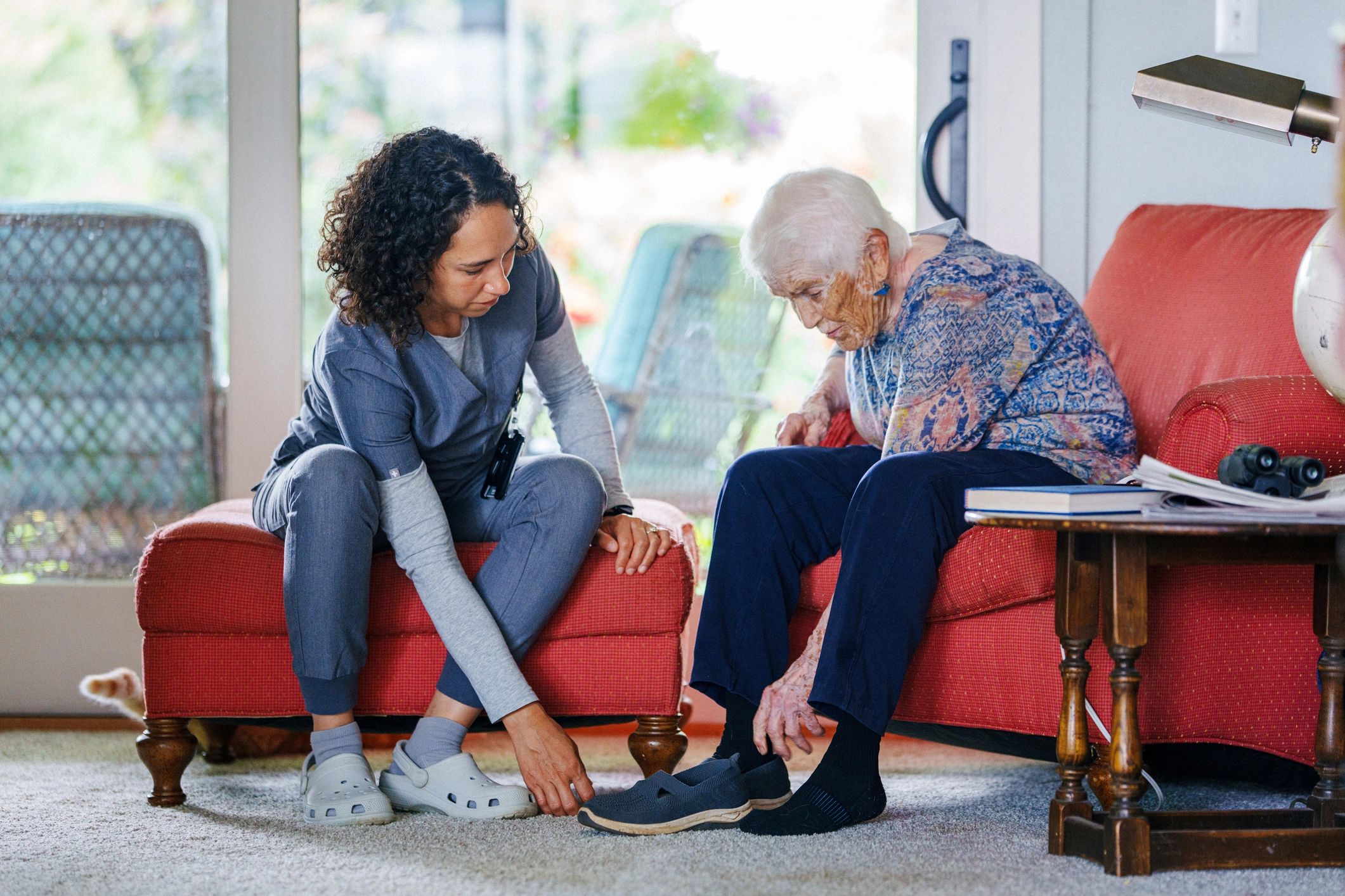 Caregiver assisting a senior woman at home in Anne Arundel County, Maryland