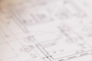 Architect marking up building plans for a permit submittal.