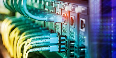 Close-up of network cables plugged into ports.