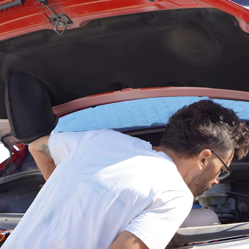 vehicle tune-up. Man checking the engine of his camper van before setting off on a road trip.