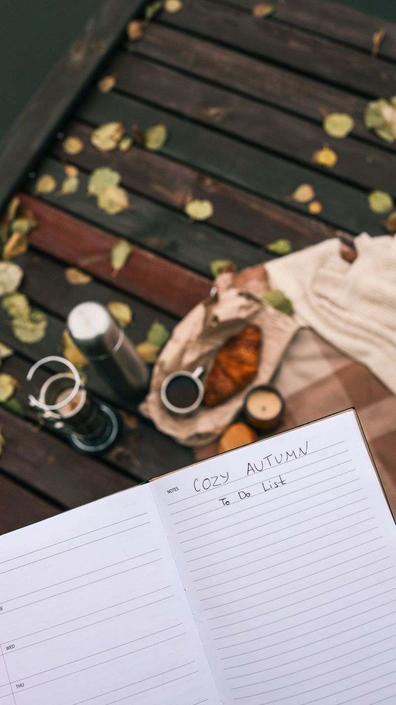Enjoy a relaxing autumn day with a warm drink, pastry, and a notebook for planning your activities
