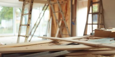 Woodwork materials and ladders inside a workshop.